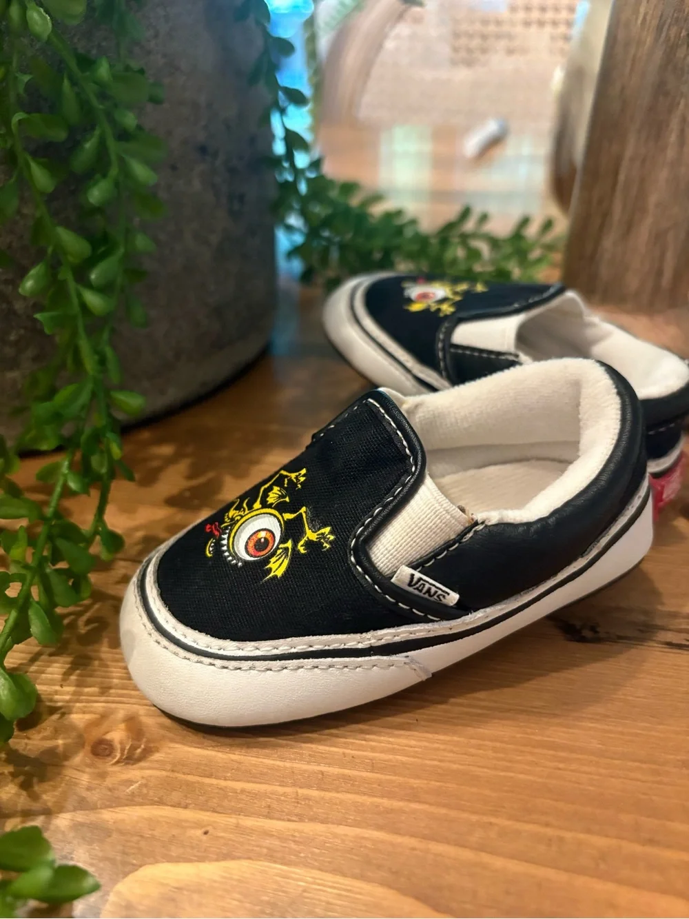 Vans Kids Black Slip-On Sneakers with Yellow and Red Monster Eyeball